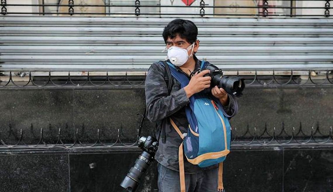 Photographer with mask